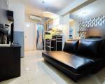 Monochrome Style 2 Bedrooms at Kalibata City Apartment By Travelio