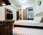 Studio Room at Green Pramuka City Apartment with Mall Access By Travelio